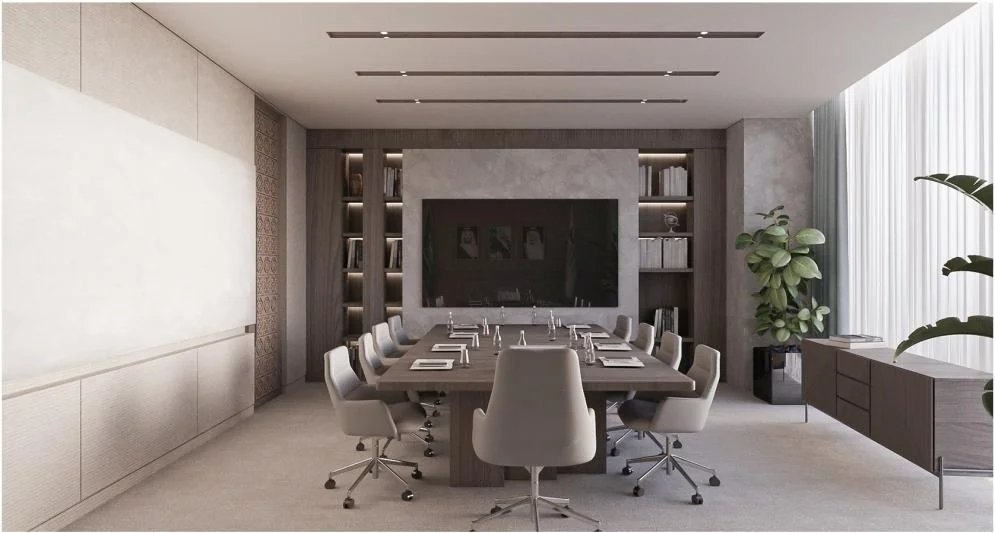 Enclosed meeting room with a long table and a wall-mounted screen.